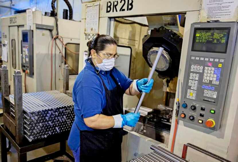 
Margarita Reyes uses a mill to cut keyway metal at Automatic Products Corp. in Garland....
