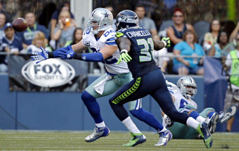 Dallas Cowboys tight end Jason Witten (82) bobbles a pass under pressure from Seattle...