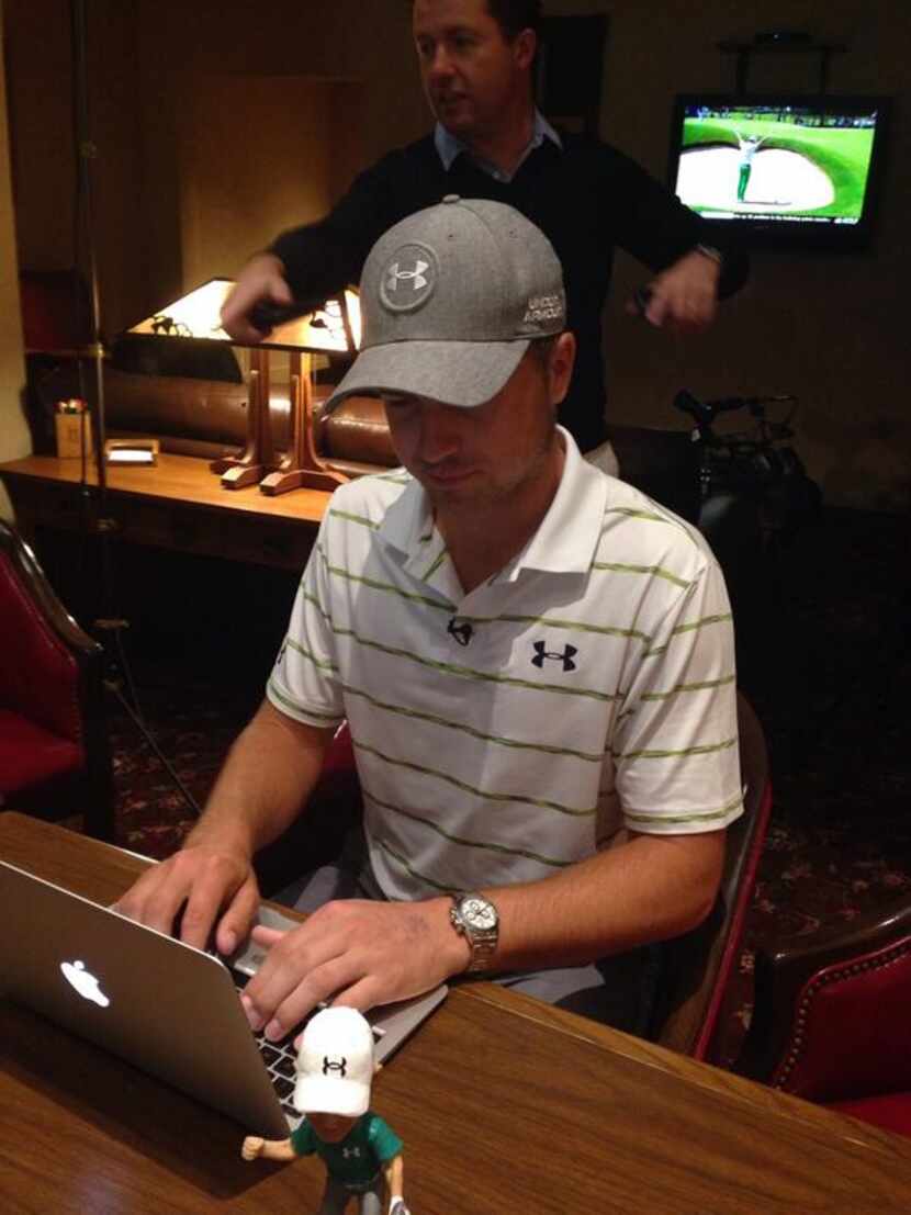 Jordan Spieth, flanked by his first bobblehead, answers questions from fans on PGATour.com...