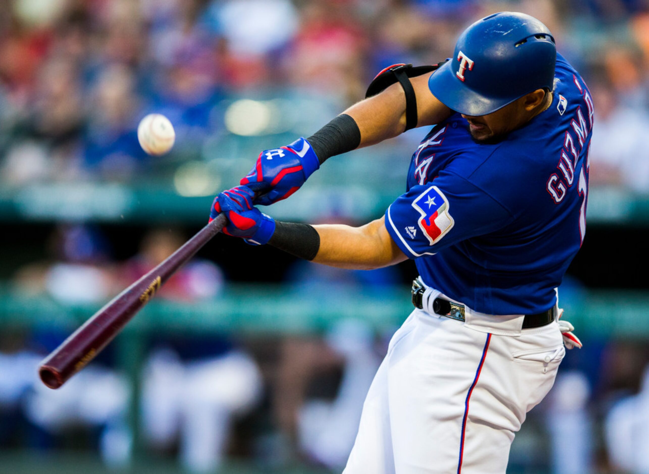 Texas Rangers first baseman Ronald Guzman (11) bats during the second inning of an MLB game...