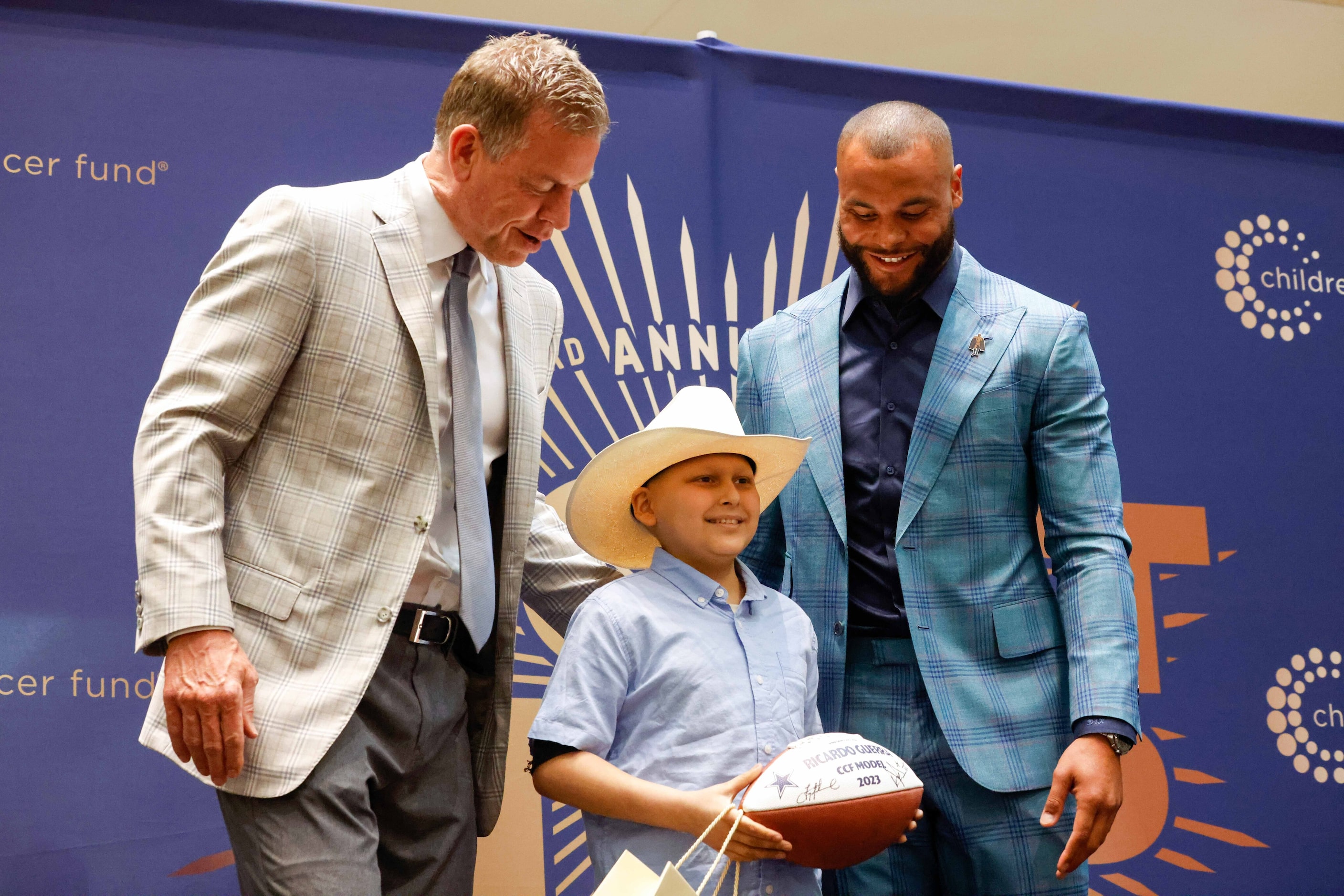 Dallas Cowboys Troy Aikman and Dak Prescott introduce Ricardo Guerra as a model for the...