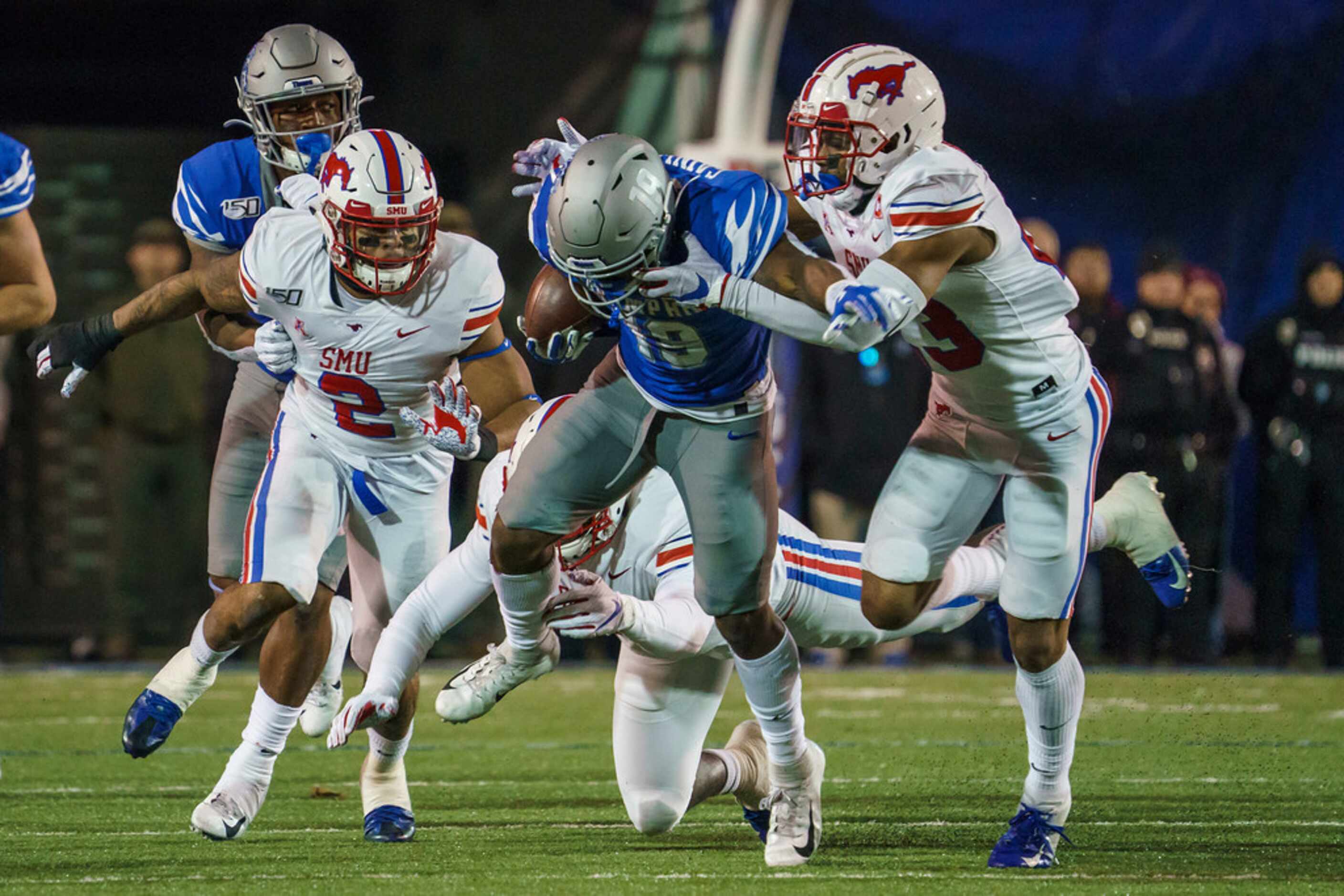 Memphis running back Kenneth Gainwell (19) is brought down by SMU safety Patrick Nelson (2)...