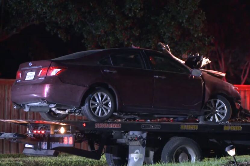 A tow truck removed a damaged car from the scene of a fatal crash Sunday night after one...