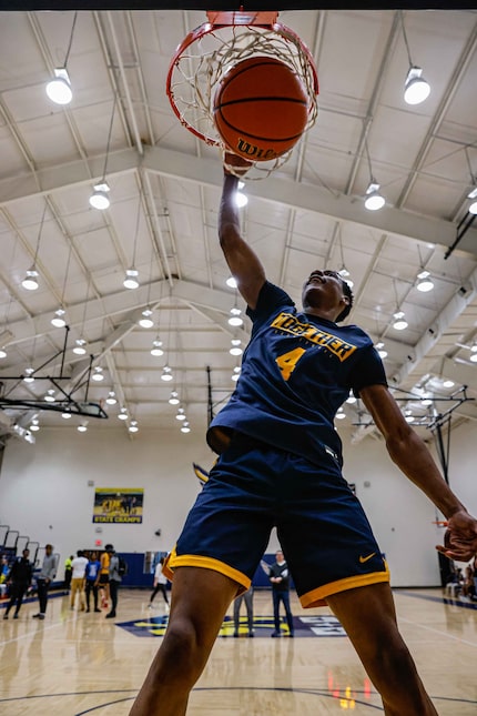 Oak Cliff Faith Family's TJ Caldwell dunks a basketball in Dallas on Wednesday, February 9,...