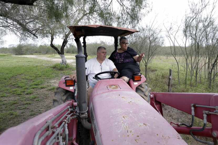 Jorge García y su esposa Aleida montan en un tractor en su rancho de Los Ebanos el 12 de...