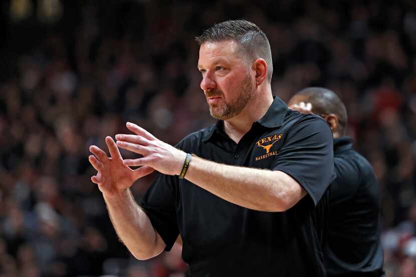 Texas coach Chris Beard yells out to his players during the second half of an NCAA college...