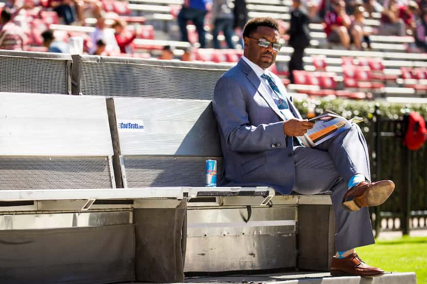 Texas A&M head coach Kevin Sumlin sits on the sidelines before an NCAA college football game...