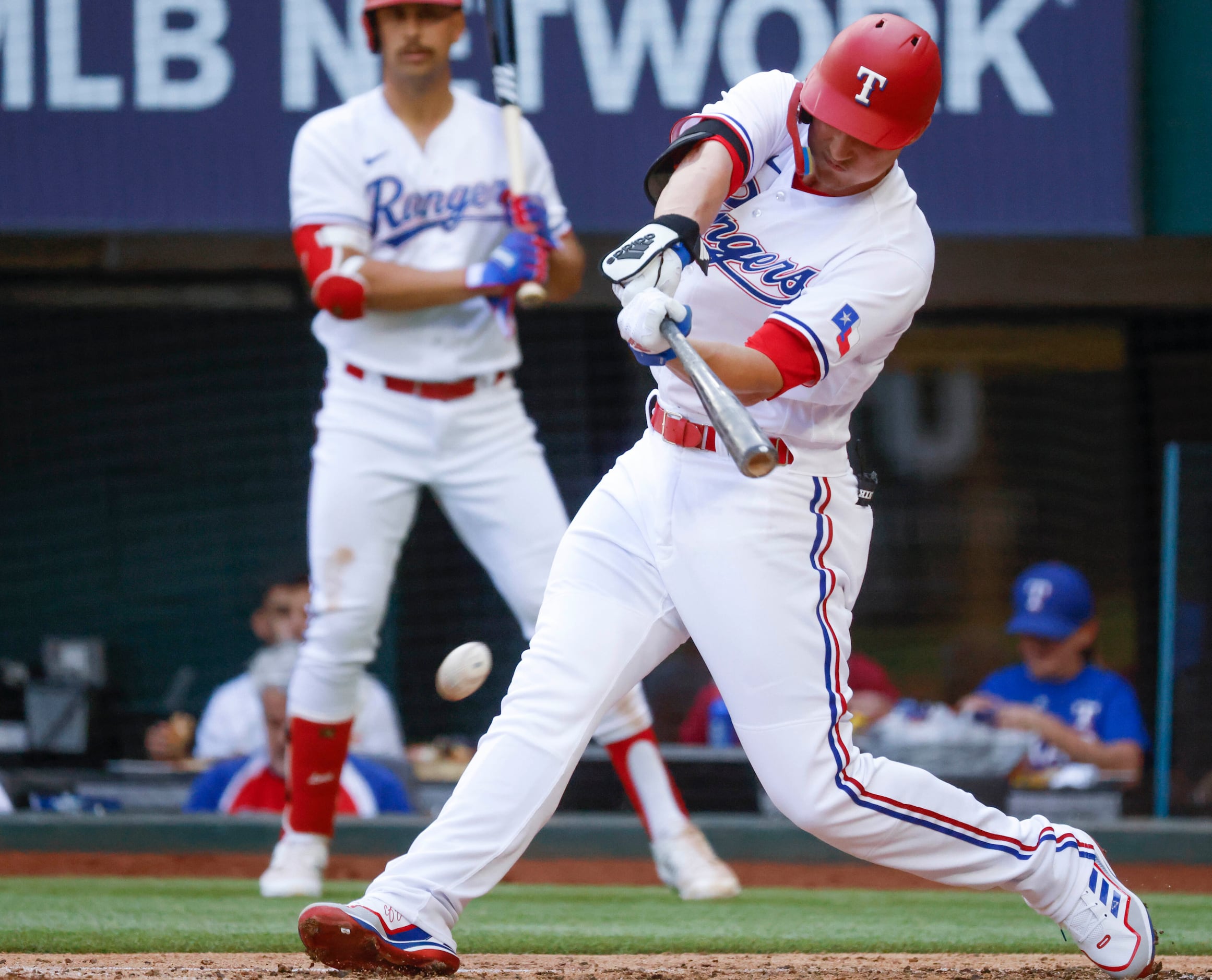 Texas Rangers shortstop Corey Seager (5) hits as he gets grounds out during the second...