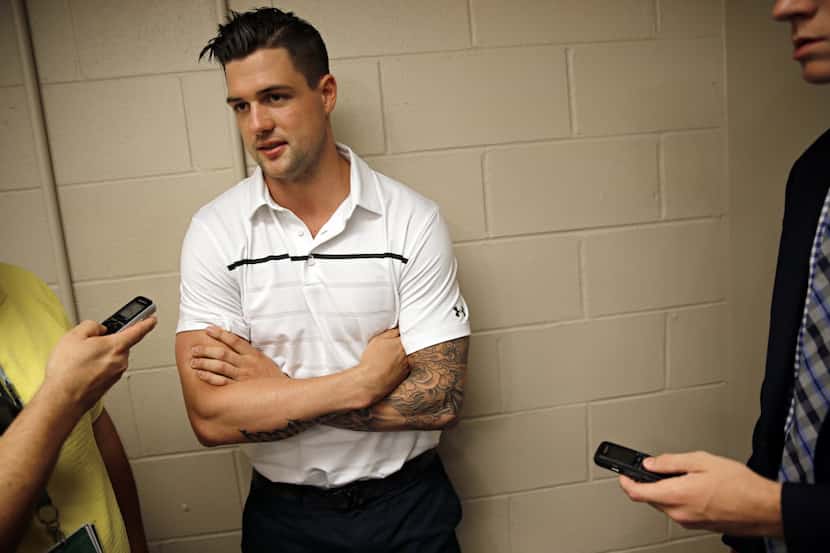 Dallas Stars captain Jamie Benn speaks to the media following a press conference to announce...