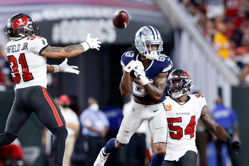 Dallas Cowboys wide receiver CeeDee Lamb (88) lets a pass slip through his fingers in the...