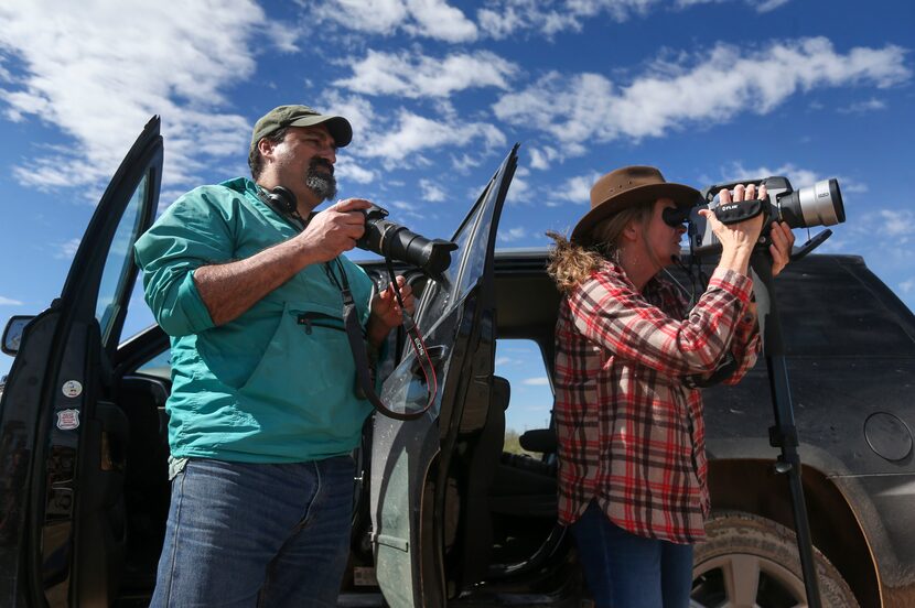 Alan Septoff and Sharon Wilson take emissions readings and video at a set of oil storage...