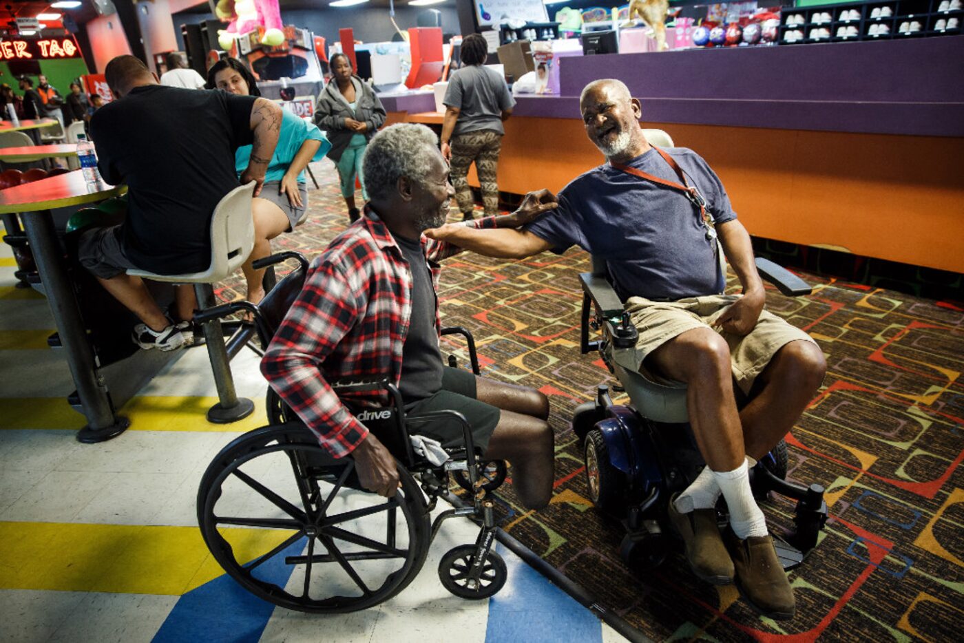 James Benoit, left, and George Clipton, right, share a light-hearted moment together at a...