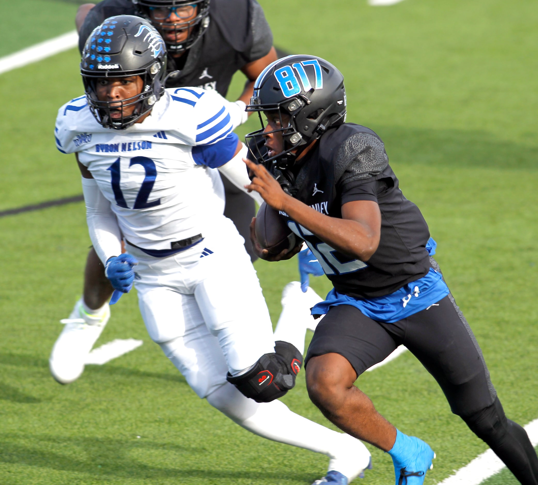 North Crowley quarterback Chris Jimerson, Jr. (12), right, rolls out of the backfield as he...