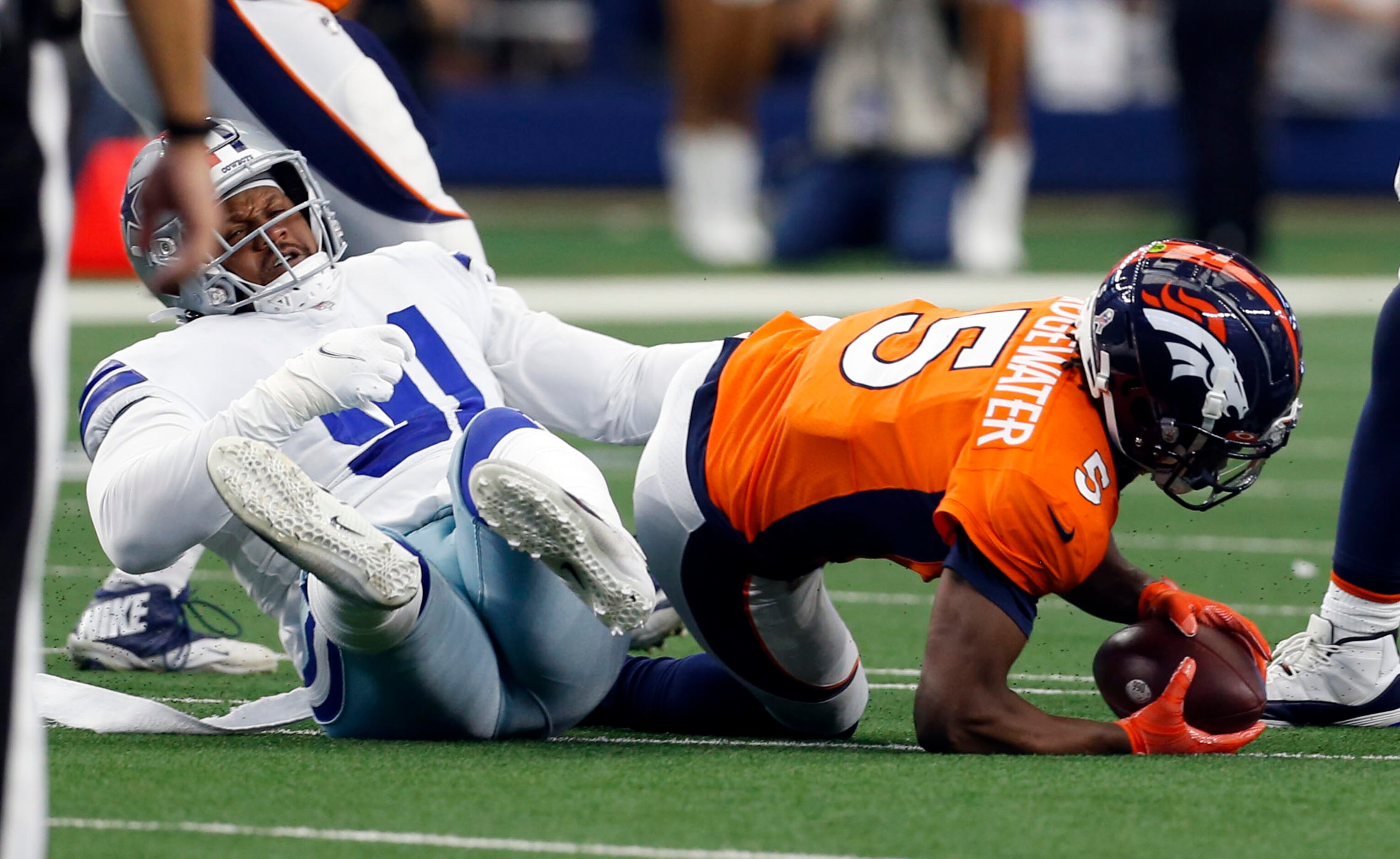 Dallas Cowboys defensive tackle Carlos Watkins (91) sacks  Denver Broncos quarterback Teddy...