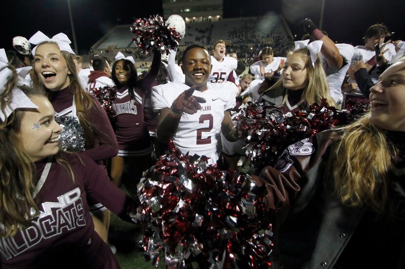 Plano running back Kyron Cumby (2) made a point to the camera moments after making a point...
