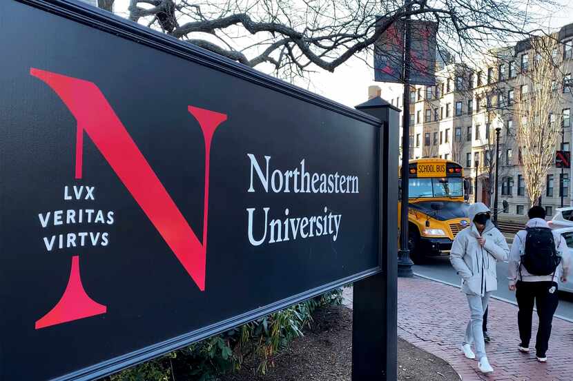 FILE - Students walk on the Northeastern University campus in Boston on Jan. 31, 2019. A...
