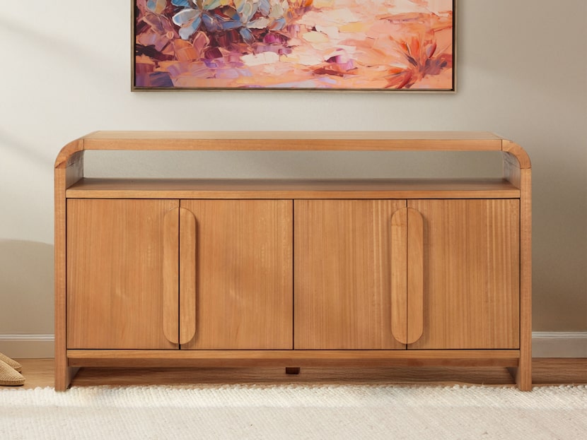 wood sideboard under artwork