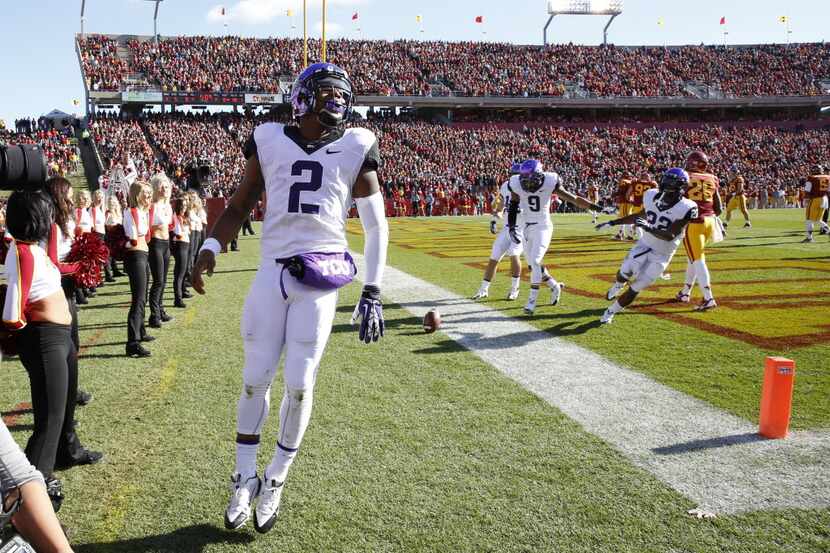 Quarterback Trevone Boykin #2 of the TCU Horned Frogs celebrates after scoring a touchdown...