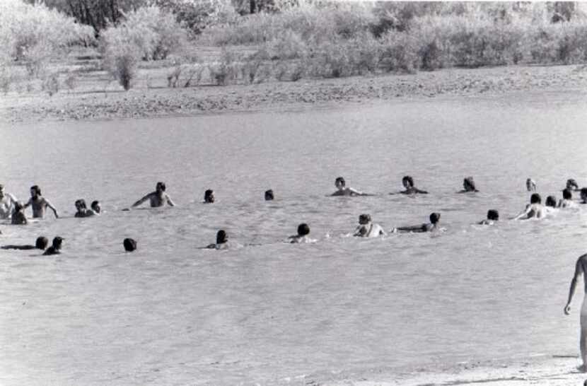 Festivalgoers swim on  Labor Day weekend 1969, during the Texas International Pop Festival. 