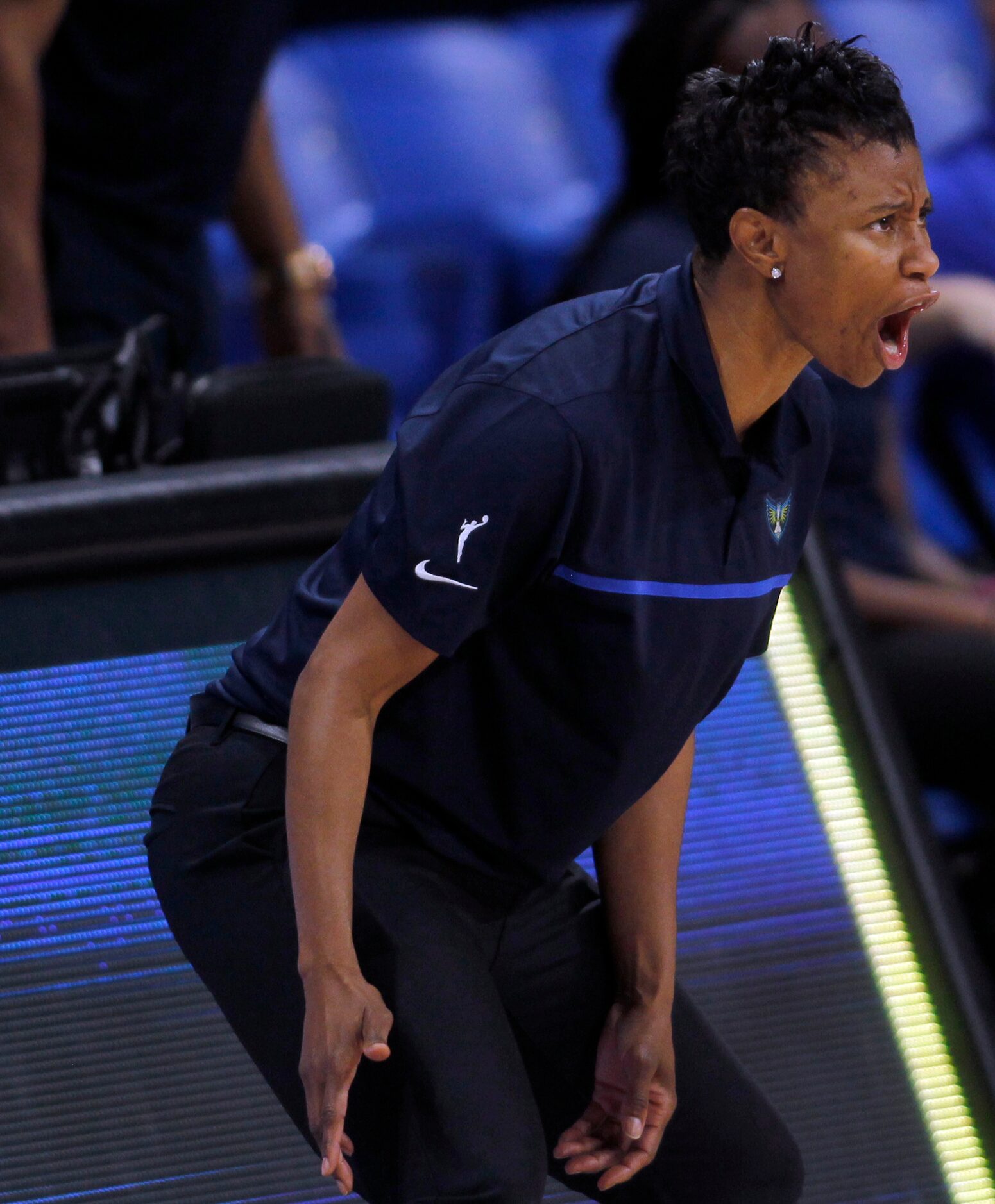 Dallas Wings head coach Vickie Johnson delivers directions form the team bench area during...