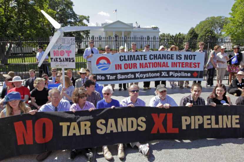 Environmental activists gather outside the White House on Aug. 22, 2011, as they continue a...