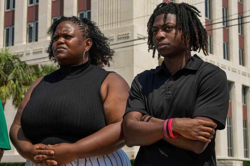 Darryl George,18, and his mother, Darresha George, are shown in front of Galveston County...
