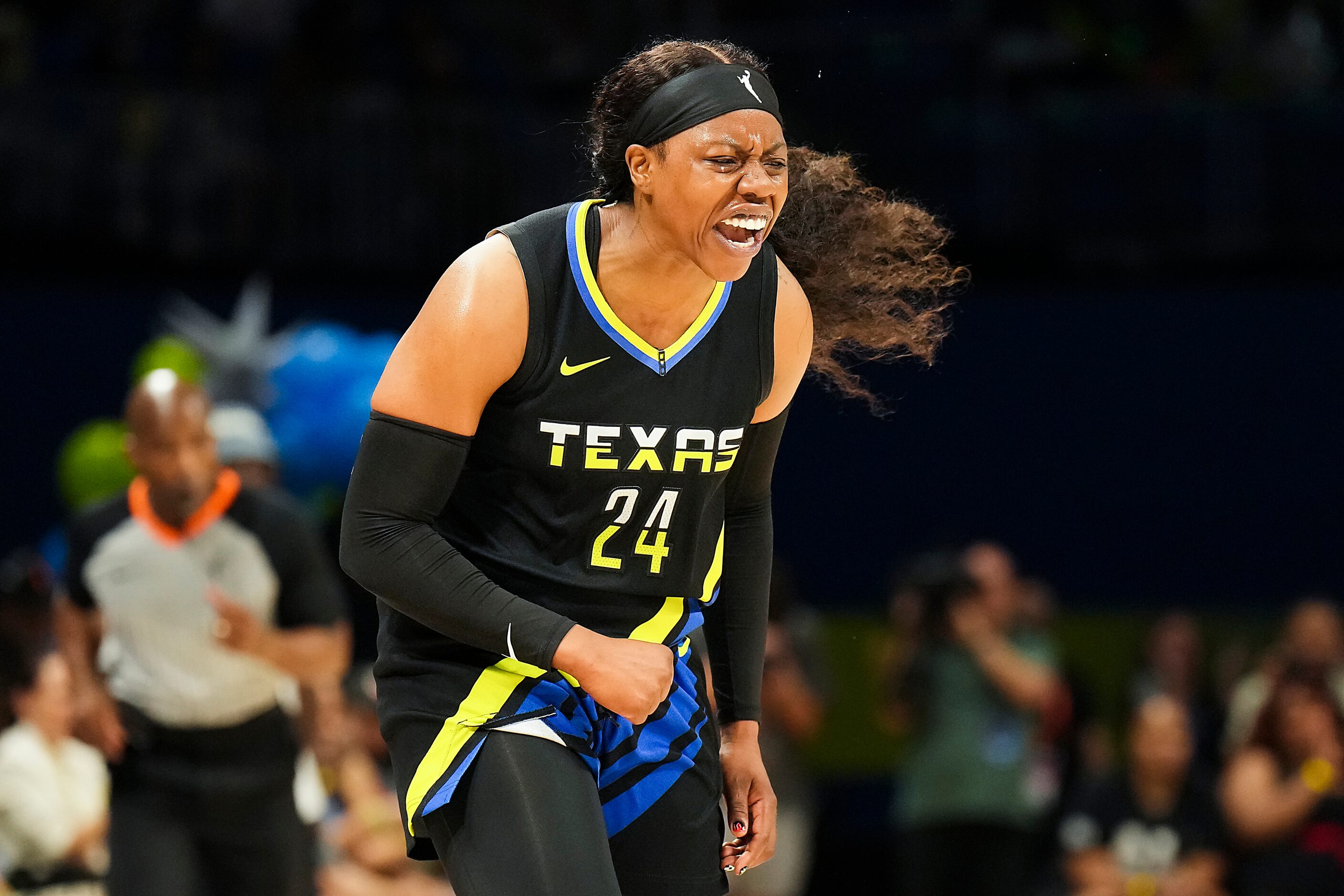 Dallas Wings guard Arike Ogunbowale (24) celebrates after hitting three-pointer during the...