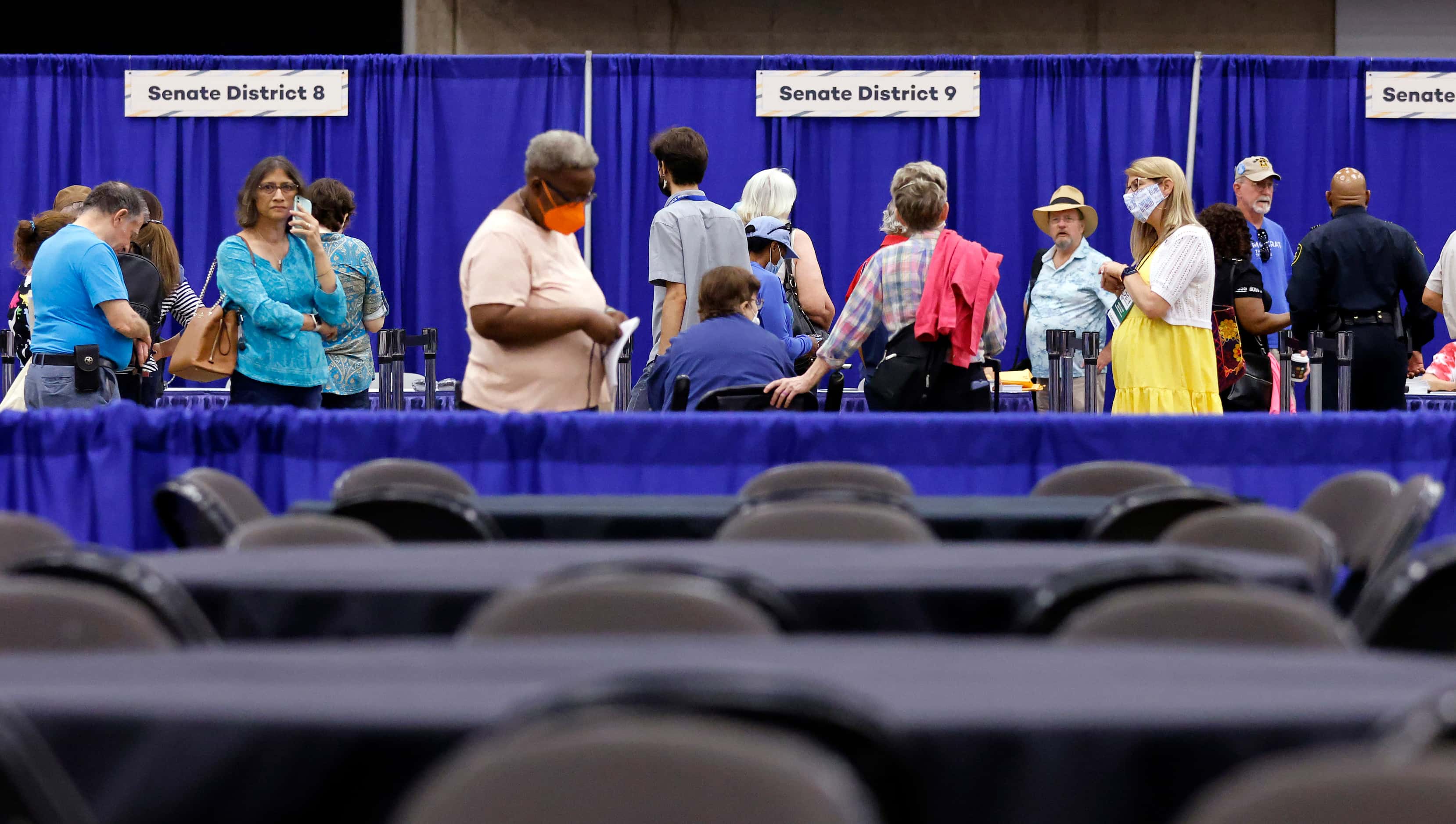 Delegates pick up their credentials during the opening day of the 2022 Texas Democratic...