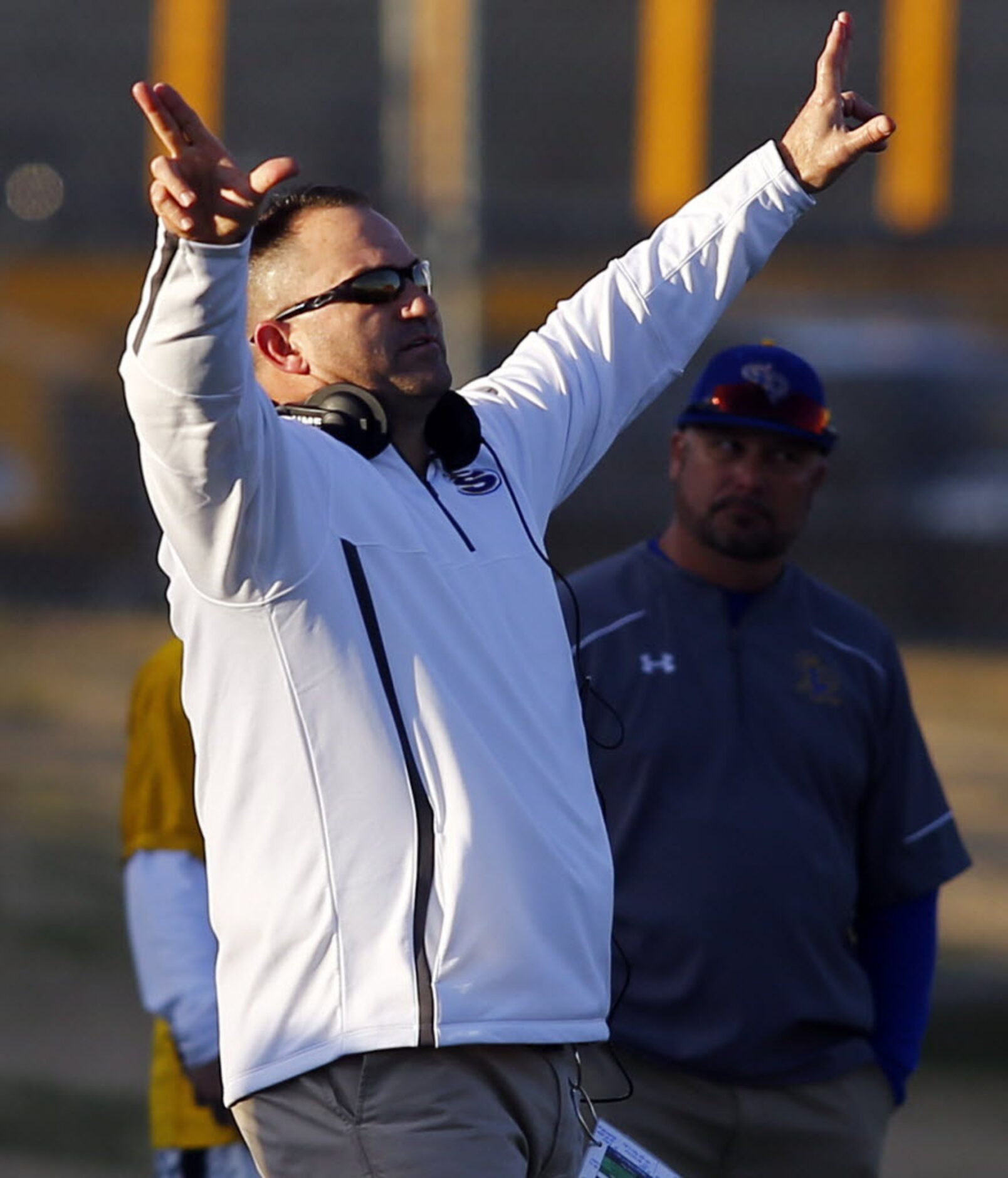 TXHSFB Sunnyvale head coach John Settle gestures to his team against Mineola in their state...