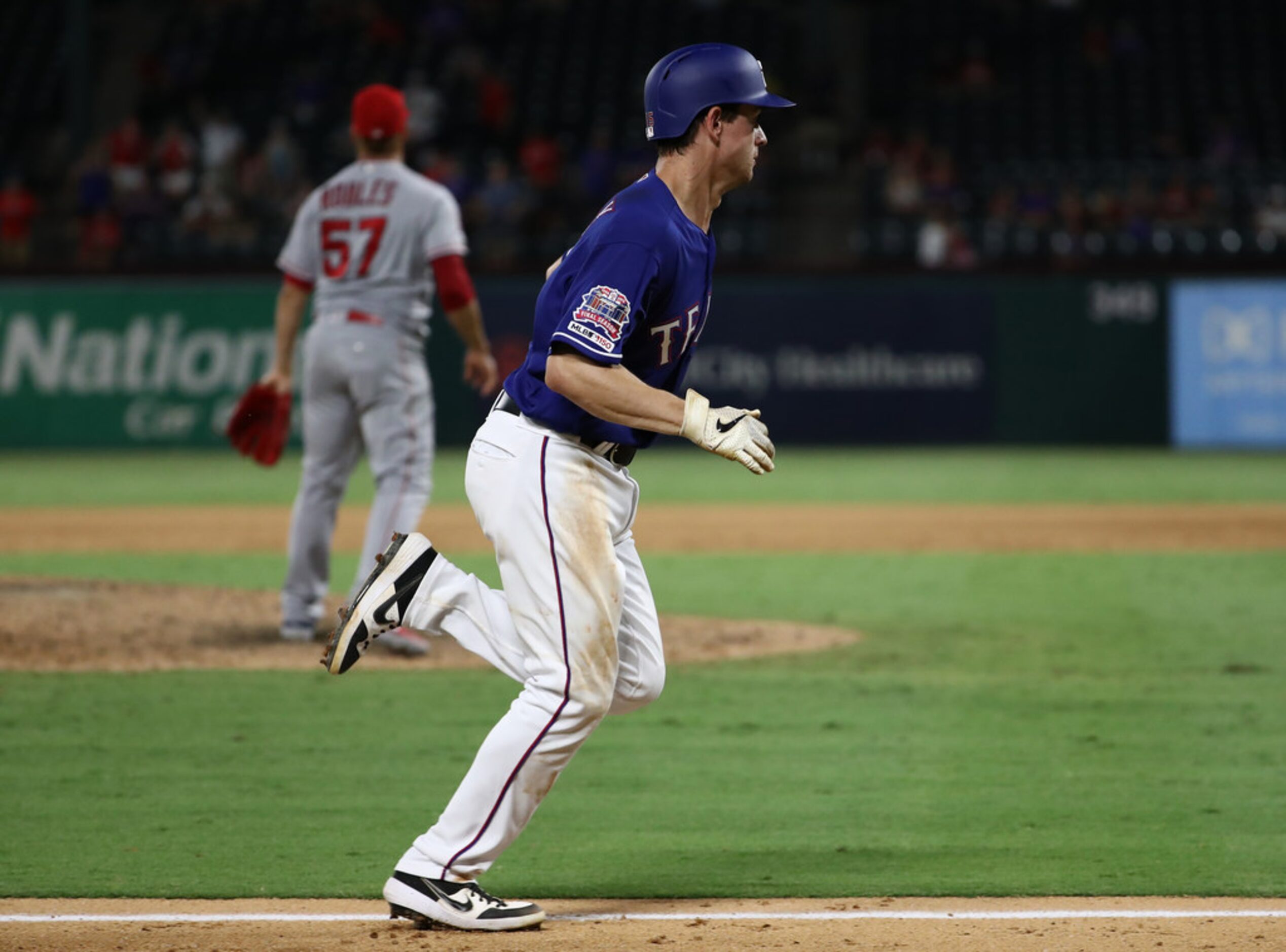 ARLINGTON, TEXAS - AUGUST 21:   Nick Solak #15 of the Texas Rangers scores against the Los...