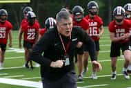 Lucas Lovejoy head coach Todd Dodge sets the example for his players as his positive energy...