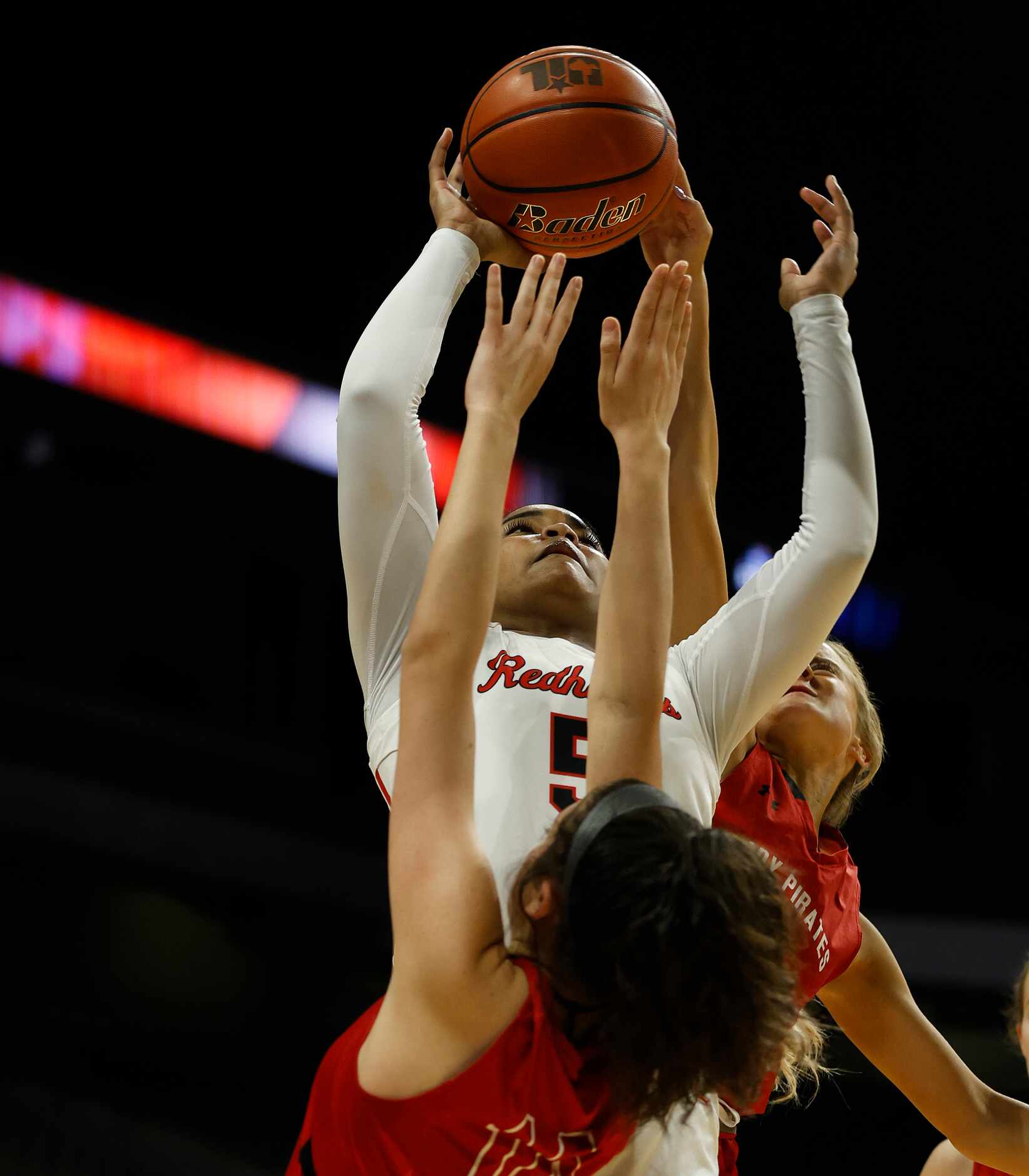 Frisco Liberty Keyera Roseby (5) shots over a Lubbock Cooper Gabby Contreras (14) player in...