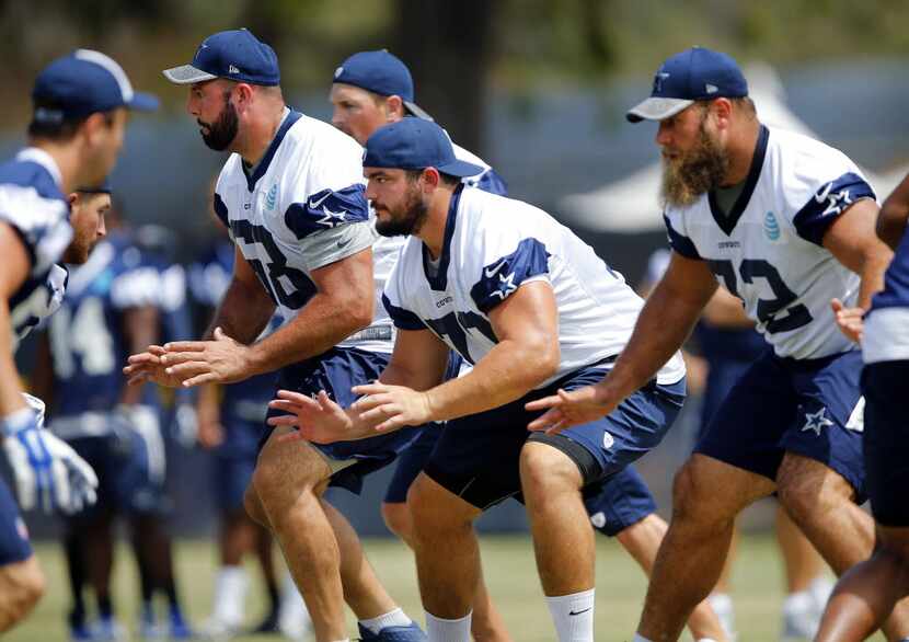 The offensive line including tackle Doug Free (68), guard Zack Martin (70) and center Travis...