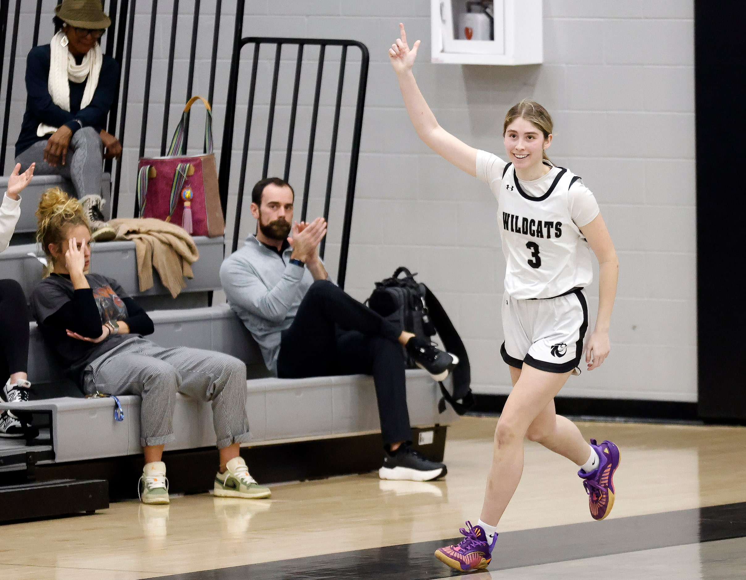 Denton Guyer’s Madison McGhie (3) reacts after sinking a second half three-pointer against...