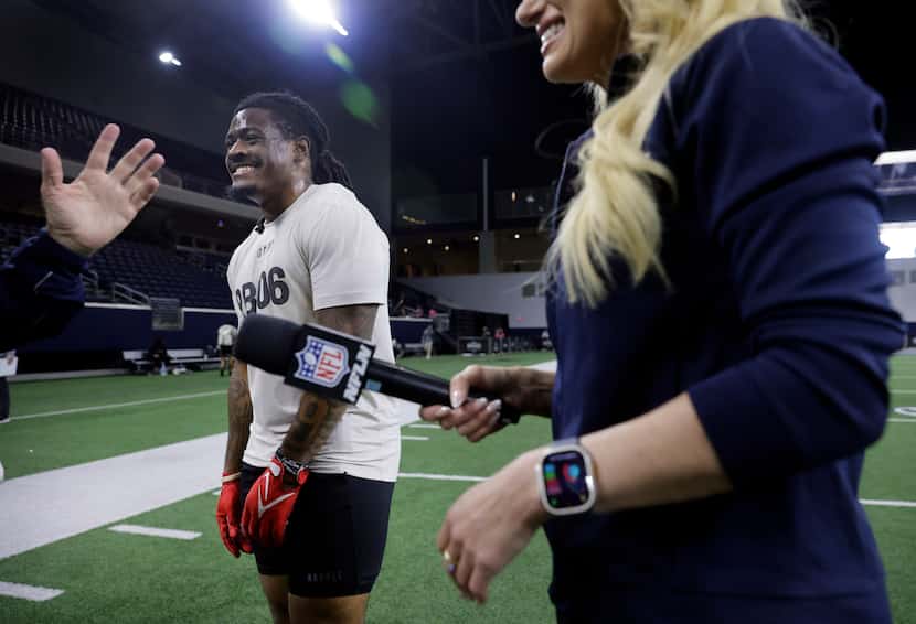 TCU running back Emani Bailey (center) laughed with NFL Network crew members following an...