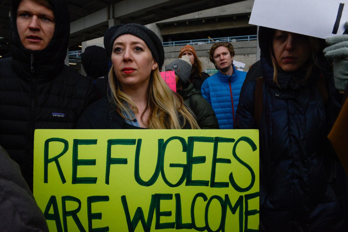 Protesters rally  during a protest against the Muslim immigration ban at John F. Kennedy...