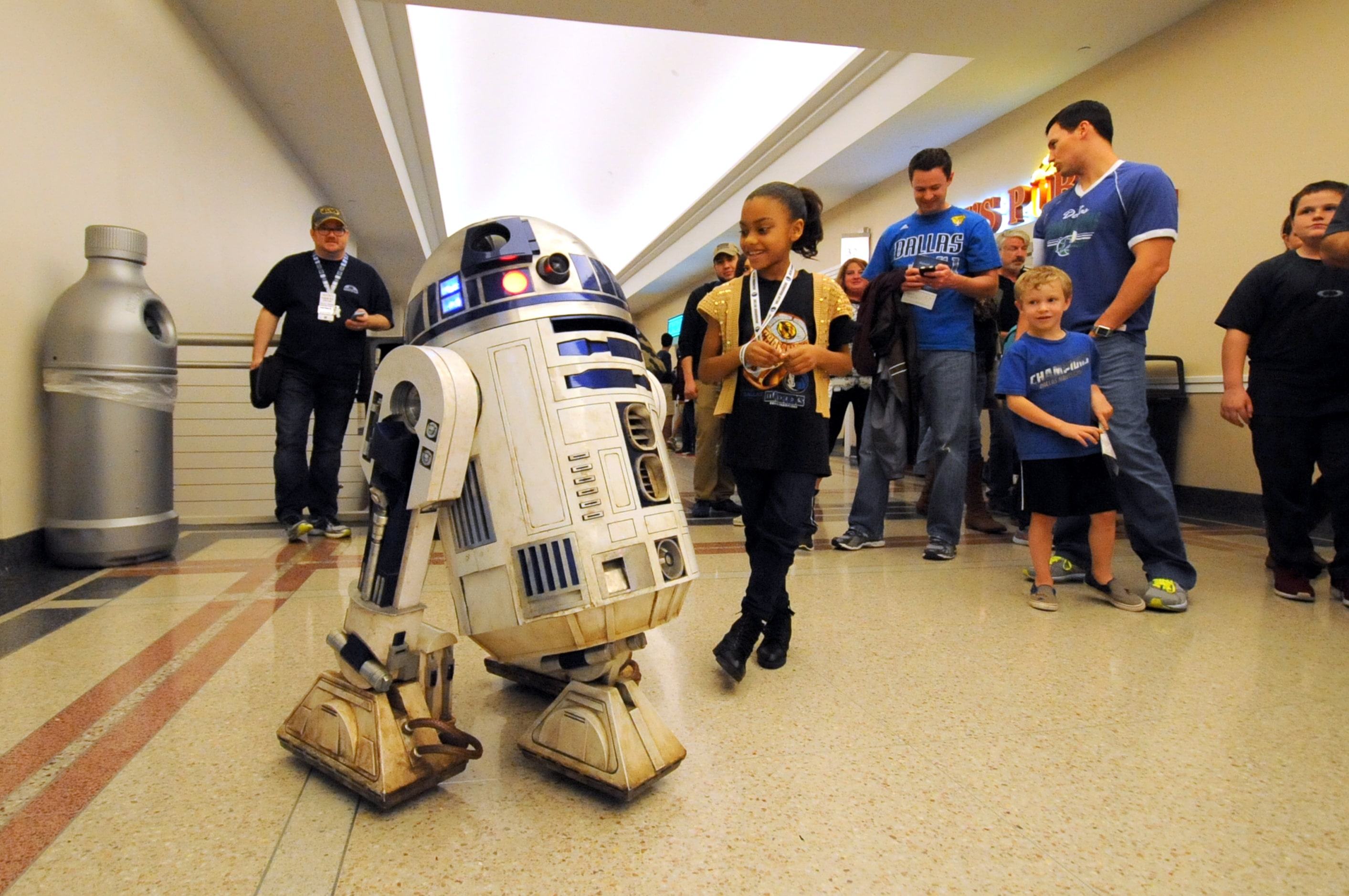 Jourin Brown meets R2-D2 at Star Wars night at the Dallas Mavericks basketball game at...