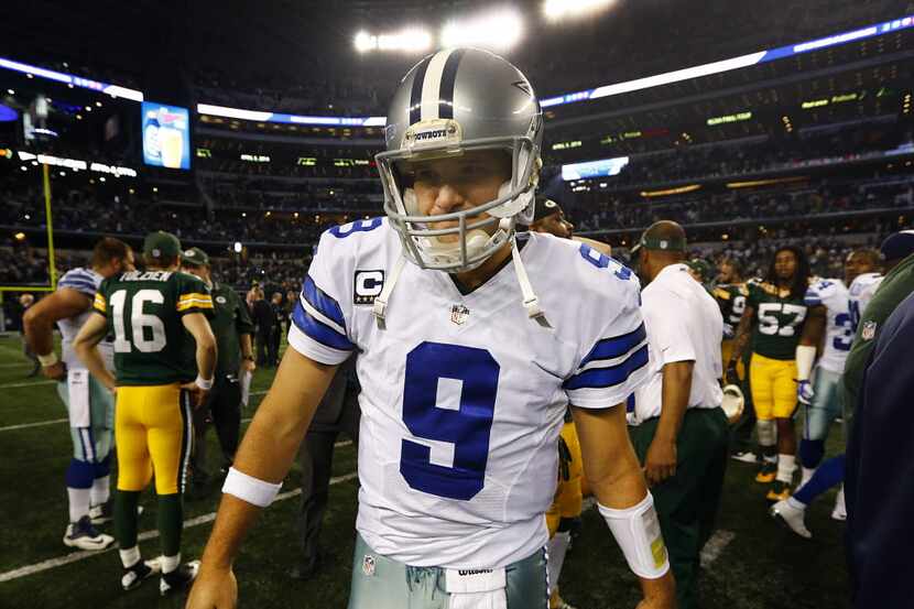 Dallas Cowboys quarterback Tony Romo (9) leaves the field after losing to the Green Bay...