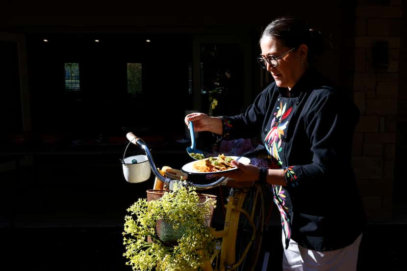 Martina de la Guti, owner of Santa Maria Artisan Kitchen catering, prepares Tacos de...