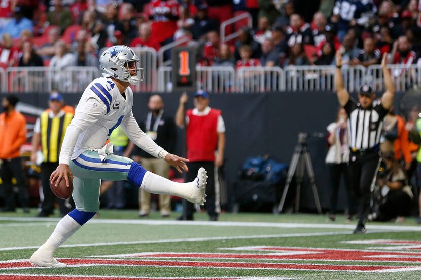 Dallas Cowboys quarterback Dak Prescott (4) celebrates after scoring a touchdown during the...