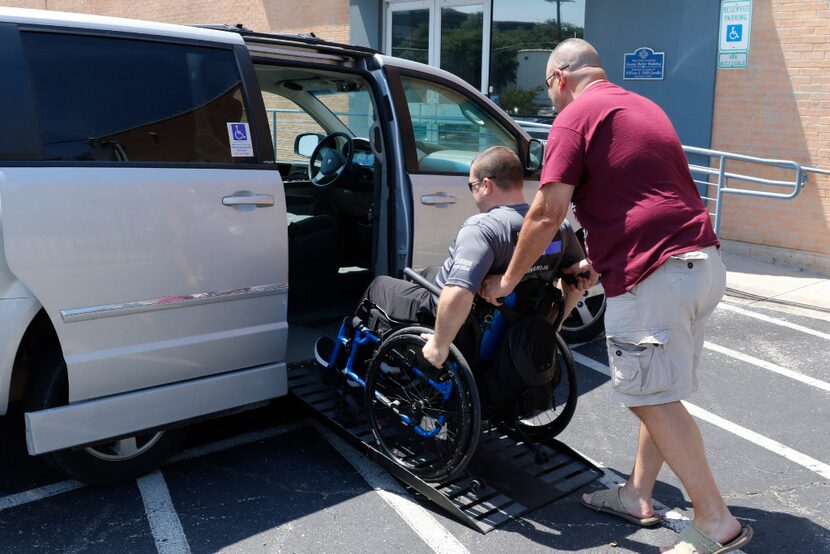 DART Detective Justin Ellis gets a little help from DART Sgt. Bart Bushman after meeting...