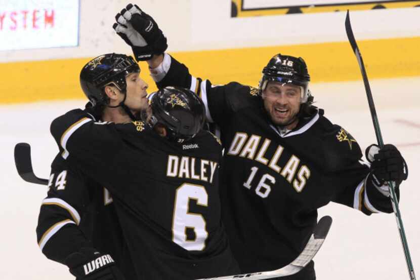 Sheldon Souray (left) is congratulated on his power play goal by teammates Trevor Daley (6)...