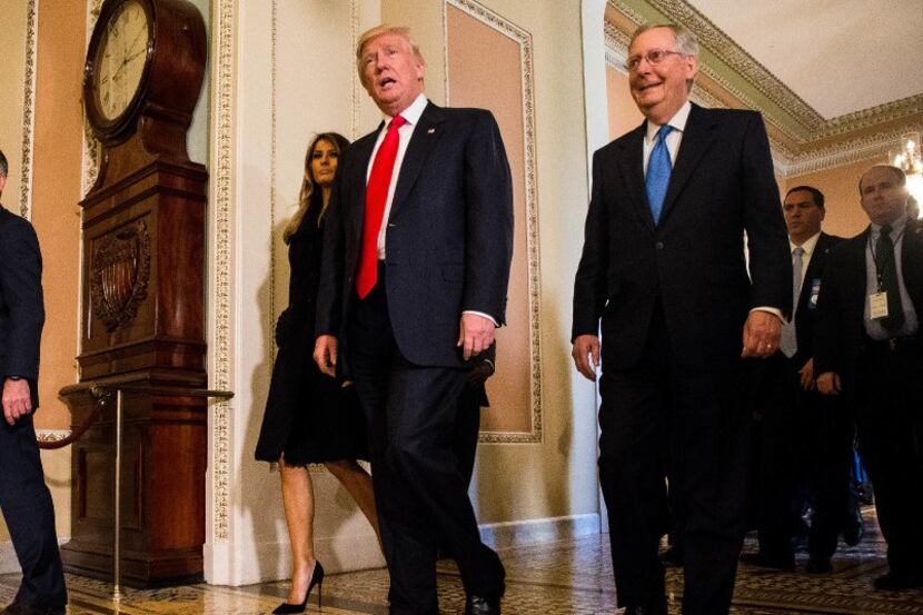 President-elect Donald Trump leaves a meeting with Senate Majority Leader Mitch McConnell...