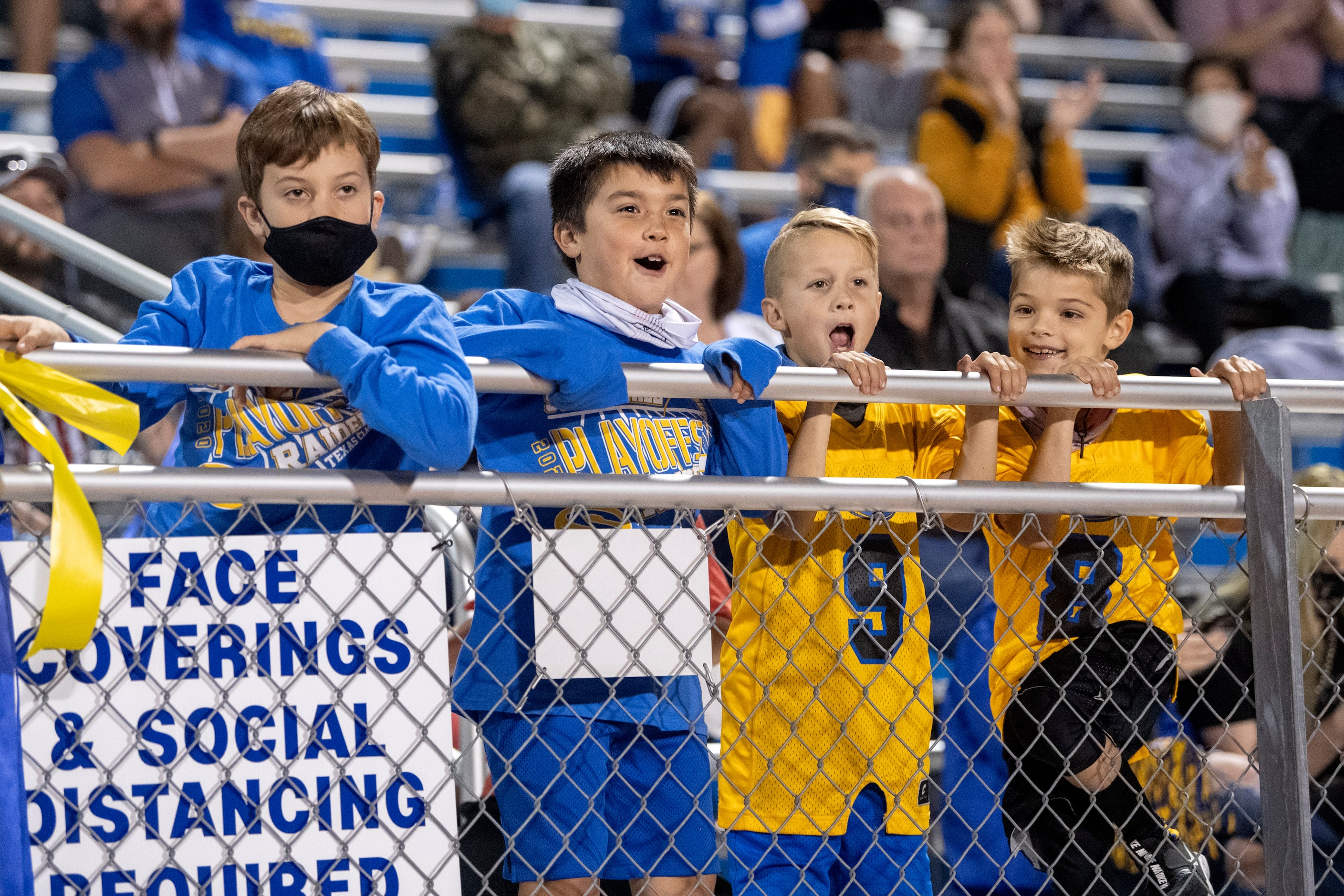 Young Sunnyvale fans cheer from the stands during the first half of a bi-district round...