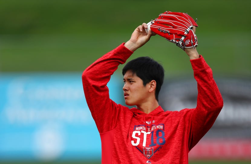 Los Angeles Angels' Shohei Ohtani throws during a spring training baseball practice on...