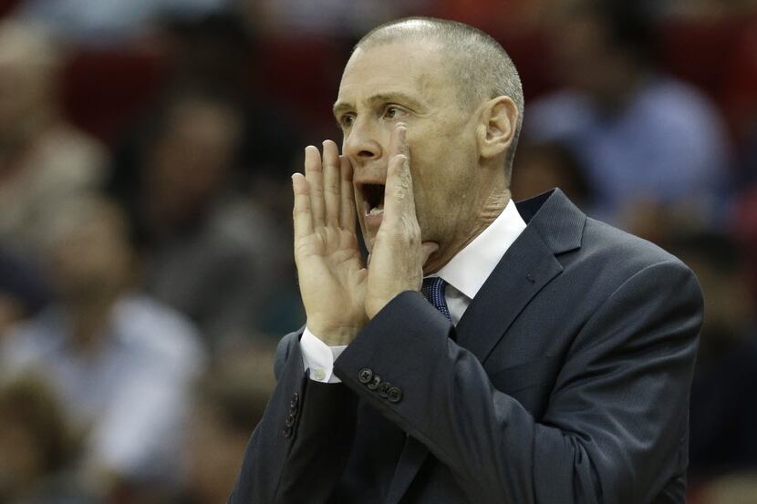 Dallas Mavericks coach Rick Carlisle yells to his players in the second half of an NBA...