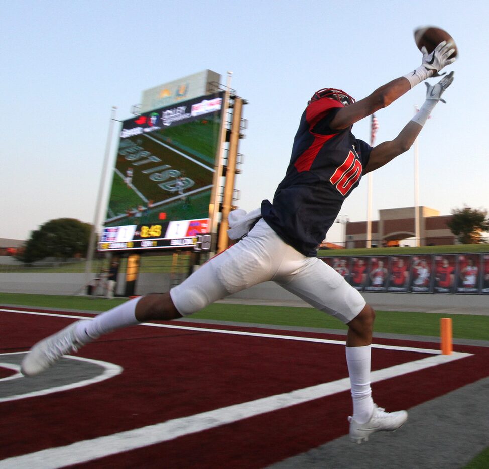 Northwest  senior receiver Leo Saldana (10) stretches for a long pass which carried him out...