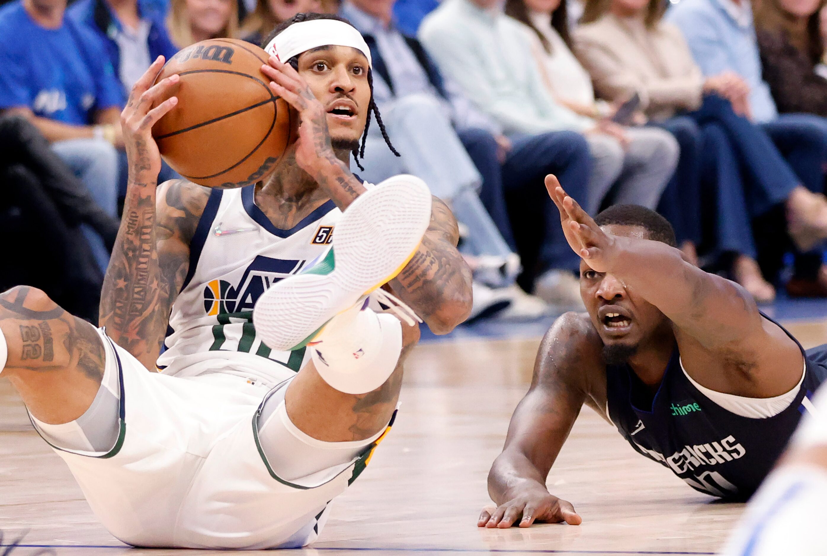 Utah Jazz guard Jordan Clarkson (00) passes the ball after scrambling for it with Dallas...