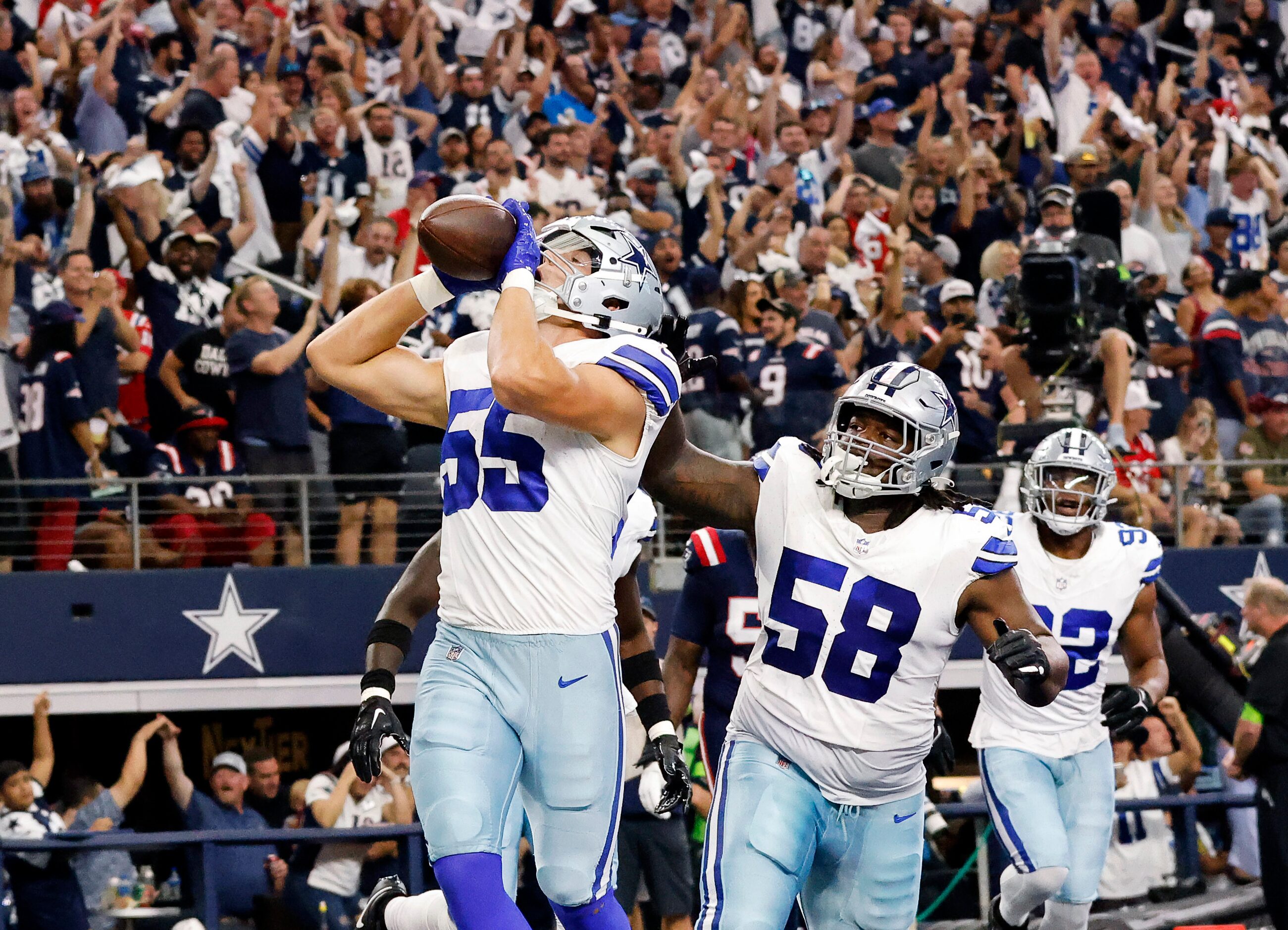 Dallas Cowboys linebacker Leighton Vander Esch (55) celebrates his scoop and score by doing...