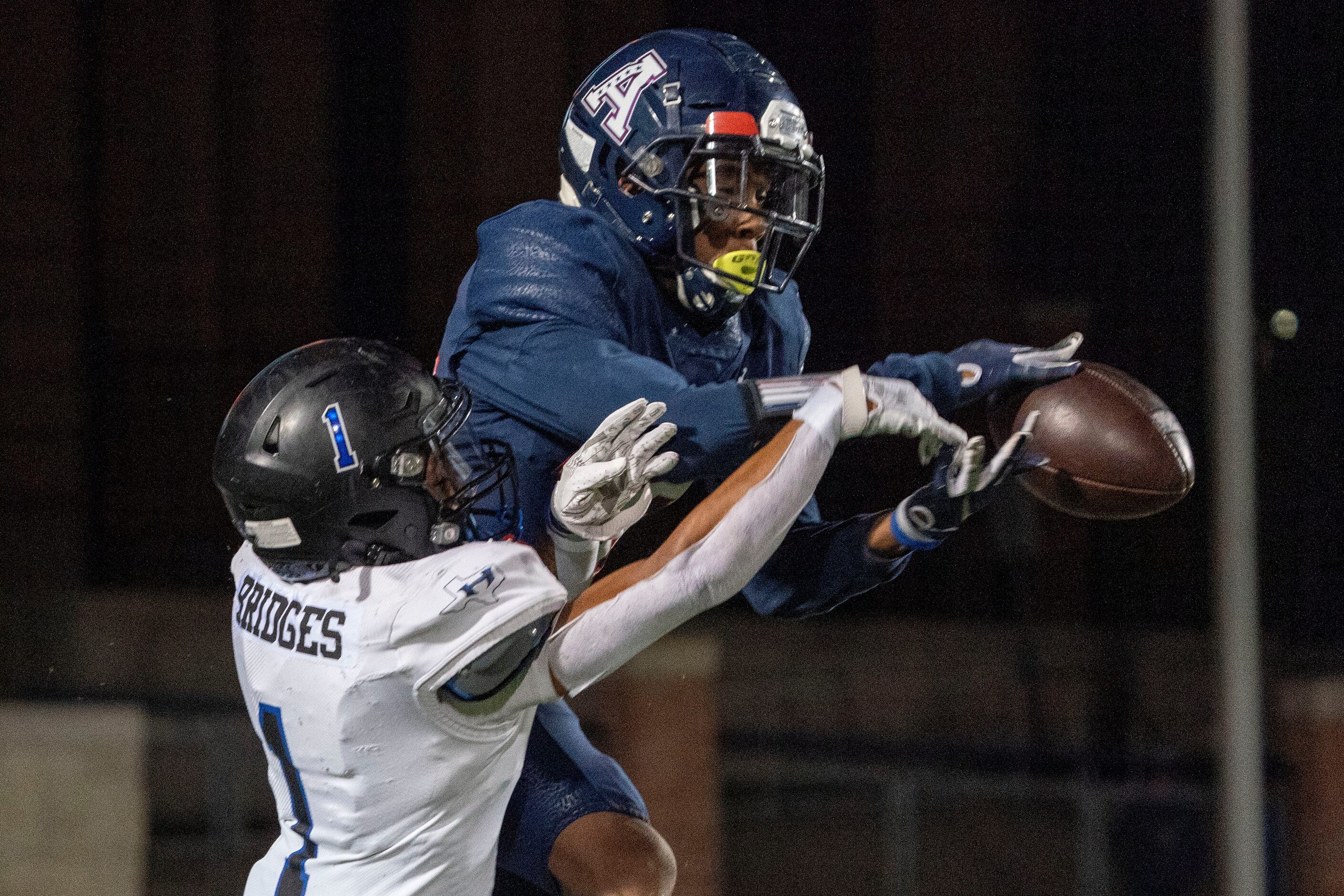 Allen senior defensive back Greg Hawkins (36) breaks up a pass intended for Hebron wide...